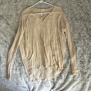 Tunic style long sleeve, v neck with a cross detail